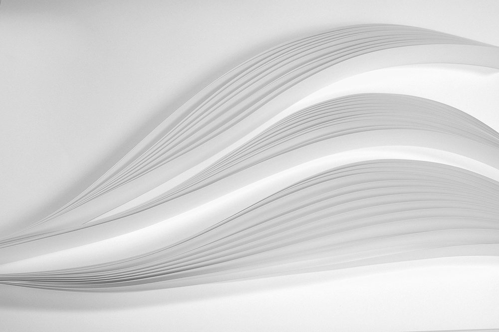 motif de courbes en ombre et lumière issues de pliages